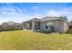 Back exterior view of house showing the screened porch at 9822 Bayboro Bridge Dr, Tampa, FL 33626