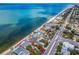 Aerial showing beachfront home and lot with ocean and neighborhood views at 1000 Gulf Blvd, Belleair Shores, FL 33786