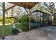 View of the backyard with pool and gazebo from under a covered patio at 11008 Browning Rd, Lithia, FL 33547