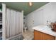 Clean bathroom with shower/tub combo and tiled floors at 11008 Browning Rd, Lithia, FL 33547