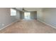 Spacious carpeted bedroom with sliding glass doors to deck at 11008 Browning Rd, Lithia, FL 33547