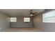 Large bedroom featuring neutral walls and ceiling fan at 11008 Browning Rd, Lithia, FL 33547