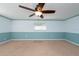 Bedroom with light blue wainscoting and ceiling fan at 11008 Browning Rd, Lithia, FL 33547