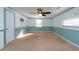 Bedroom with light blue wainscoting and ceiling fan at 11008 Browning Rd, Lithia, FL 33547