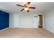 Spacious bedroom with neutral walls and carpet, ceiling fan, and ample closet space at 11008 Browning Rd, Lithia, FL 33547