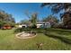 Two-story house, detached garage, fire pit, and expansive yard at 11008 Browning Rd, Lithia, FL 33547
