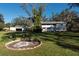 Two-story house, detached garage, fire pit, and expansive yard at 11008 Browning Rd, Lithia, FL 33547