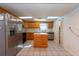 Kitchen features wood cabinets, stainless steel appliances and island at 11008 Browning Rd, Lithia, FL 33547