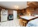 Kitchen with wood cabinets, breakfast bar, and appliances at 11008 Browning Rd, Lithia, FL 33547