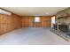 Living room with wood paneling and fireplace at 11008 Browning Rd, Lithia, FL 33547