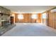 Living area with wood paneling and fireplace at 11008 Browning Rd, Lithia, FL 33547