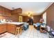 Open living room and kitchen with wood cabinets and tiled floors at 11008 Browning Rd, Lithia, FL 33547