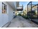 Side yard with patio, deck, and exterior access at 11008 Browning Rd, Lithia, FL 33547