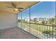 The balcony features a ceiling fan and a view of the pond and community at 1200 Country Club Dr # 3204, Largo, FL 33771