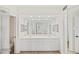 Bathroom featuring double vanity sinks, neutral tile floors, and large mirrors at 1200 Country Club Dr # 3204, Largo, FL 33771