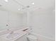 Bathroom featuring a bathtub, a shower, a toilet, and a vanity at 1200 Country Club Dr # 3204, Largo, FL 33771