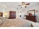 Main bedroom with two dressers and king-size bed at 1200 Country Club Dr # 3204, Largo, FL 33771