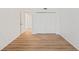 This bedroom features light wood floors, a large closet, and white walls at 1200 Country Club Dr # 3204, Largo, FL 33771