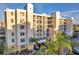 Lovely exterior view of the condo building with balconies and palm trees at 1200 Country Club Dr # 3204, Largo, FL 33771