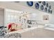 Bright kitchen featuring white cabinets and appliances, and an adjacent breakfast nook at 1200 Country Club Dr # 3204, Largo, FL 33771