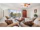 Bright living room with golf course view and comfy furniture at 1200 Country Club Dr # 3204, Largo, FL 33771