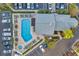 Aerial view of the complex pool, spa, and surrounding amenities at 1200 Country Club Dr # 3204, Largo, FL 33771