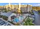 Inviting community pool and spa area surrounded by lush landscaping and comfortable seating at 1200 Country Club Dr # 3204, Largo, FL 33771