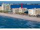 Aerial view of beachfront condo building with ocean and city views at 1400 Gulf Blvd # 801, Clearwater Beach, FL 33767