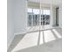 Sunlit bedroom features glass sliding doors leading to balcony at 1400 Gulf Blvd # 801, Clearwater Beach, FL 33767