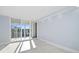 Light, airy bedroom with white tile floors and balcony access at 1400 Gulf Blvd # 801, Clearwater Beach, FL 33767