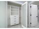 Bright walk in closet with built in shelves and drawers at 1400 Gulf Blvd # 801, Clearwater Beach, FL 33767