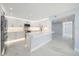Modern white kitchen with stainless steel appliances and quartz countertops at 1400 Gulf Blvd # 801, Clearwater Beach, FL 33767
