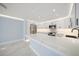 Bright modern kitchen with a large island, white cabinets, marble countertops, and stainless appliances at 1400 Gulf Blvd # 801, Clearwater Beach, FL 33767