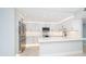 Bright modern kitchen with white cabinets, marble countertops, stainless steel appliances and ample storage at 1400 Gulf Blvd # 801, Clearwater Beach, FL 33767