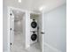 Convenient laundry closet featuring a stackable washer and dryer at 1400 Gulf Blvd # 801, Clearwater Beach, FL 33767