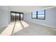 Sunlit living room with stunning ocean views and tile floors at 1400 Gulf Blvd # 801, Clearwater Beach, FL 33767