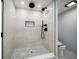 Contemporary shower features rain head fixture, mosaic tiled floor, and built-in niche at 1400 Gulf Blvd # 801, Clearwater Beach, FL 33767