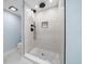 Contemporary shower features rain head fixture, mosaic tiled floor, and built-in niche at 1400 Gulf Blvd # 801, Clearwater Beach, FL 33767