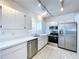 Modern kitchen with stainless steel appliances and white cabinets at 16861 Le Clare Shores Dr, Tampa, FL 33624