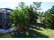 Mature trees and lush landscaping in backyard at 1727 Coco Palm Cir, Sun City Center, FL 33573