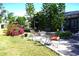 Relaxing backyard patio with seating area and lush landscaping at 1727 Coco Palm Cir, Sun City Center, FL 33573