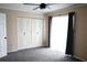 Bedroom features a large closet, carpet flooring, and a bright window at 1727 Coco Palm Cir, Sun City Center, FL 33573