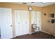 Bedroom with a neutral color palette featuring closet doors and simple decor at 1727 Coco Palm Cir, Sun City Center, FL 33573