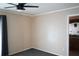 Bedroom with neutral walls, carpet flooring, and a view into the bathroom at 1727 Coco Palm Cir, Sun City Center, FL 33573
