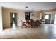 Open-concept dining room with tile flooring and traditional chandelier at 1727 Coco Palm Cir, Sun City Center, FL 33573