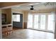 Spacious dining room with tile flooring, French doors, and a view to a bar area with seating at 1727 Coco Palm Cir, Sun City Center, FL 33573
