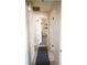 Clean hallway with tile flooring and access to other rooms at 1727 Coco Palm Cir, Sun City Center, FL 33573