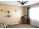 Living room with ceiling fan, wall sconces, and comfortable seating at 1727 Coco Palm Cir, Sun City Center, FL 33573