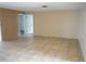 Empty living room featuring neutral walls and tile flooring at 1727 Coco Palm Cir, Sun City Center, FL 33573
