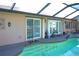 Private pool area with sliding glass doors to interior at 1727 Coco Palm Cir, Sun City Center, FL 33573